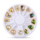 Meem'z Gold-Framed Mixed Shape Aurora Rhinestone Wheel showing 12 compartments with framed heart teardrop square and chevron crystal rhinestones