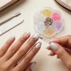 Close-up of translucent aurora jelly bear nail charms in multiple iridescent colours for nail art