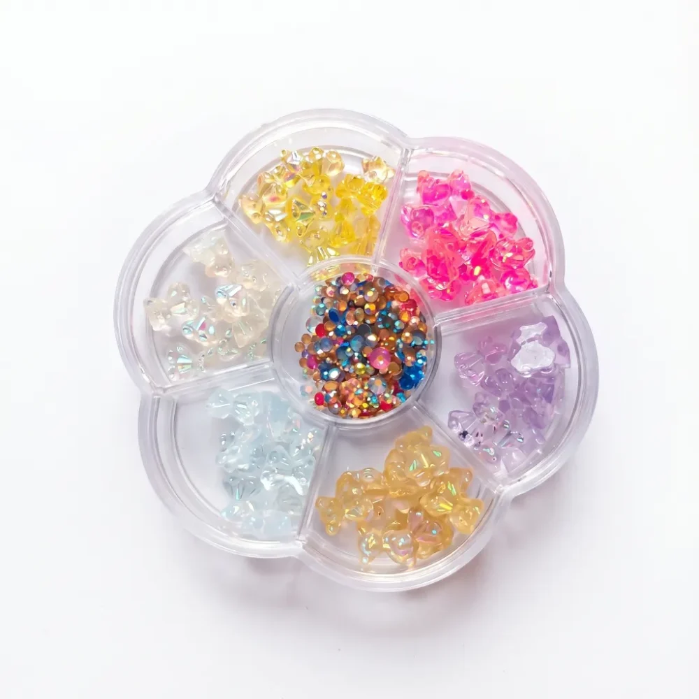 Close-up of translucent aurora jelly bear nail charms in multiple iridescent colours for nail art