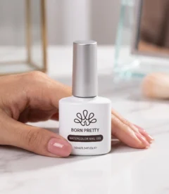 Born Pretty Water Blooming Gel 10ml Blooming gel is one of the most creative specialty products in nail art. It creates the ink blooming effect where gel colours dropped onto a wet blooming gel base flow outward organically in soft fluid patterns that replicate the look of ink dropped into water. The results are different every time which is part of what makes this technique so popular. No two blooming gel nail sets look exactly the same. How Blooming Gel Works The blooming gel acts as a reactive wet surface that allows gel colours to flow and blend across it in organic patterns. Apply a layer of blooming gel over a cured base and do not cure the blooming gel. While the blooming gel is still wet, drop or paint small amounts of gel colour onto the surface. The colour immediately begins to bloom and spread outward through the wet blooming gel, creating natural flowing patterns. Once happy with the pattern cure everything together. Effects You Can Create Marble and stone nail art with natural veining patterns Watercolour wash effects with soft blended colour transitions Ink bloom designs with organic spreading colour patterns Abstract art nail designs with unpredictable organic shapes Ombre and gradient effects with soft diffused colour transitions Negative space designs where colour blooms only in specific areas Key Specifications Brand: Born Pretty Volume: 10ml Type: Blooming and reactive nail art gel Effect: Water bloom, marble, ink drop nail art Cure: UV or LED lamp after design is complete Tips for Best Results Work quickly once the blooming gel is applied as it begins to self-level and can change the bloom pattern if left too long before adding colour. Use thin, concentrated drops of gel colour for precise bloom control. Adding more colour creates more dramatic spreading patterns. For a subtle watercolour effect use very small amounts of diluted colour. Once cured the blooming pattern is locked permanently and can be sealed with any top coat. Important Do not cure the blooming gel layer before adding your colours. The wet blooming gel must remain uncured for the blooming reaction to occur. Curing it first sets the gel and the bloom effect will not work on a cured surface.